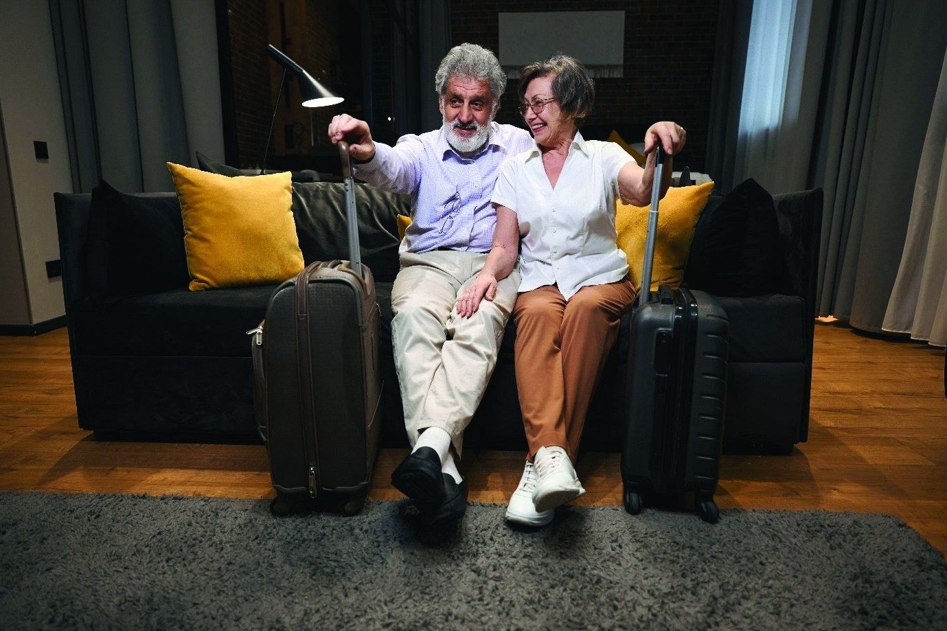 Senior travelers arriving at a hotel suite