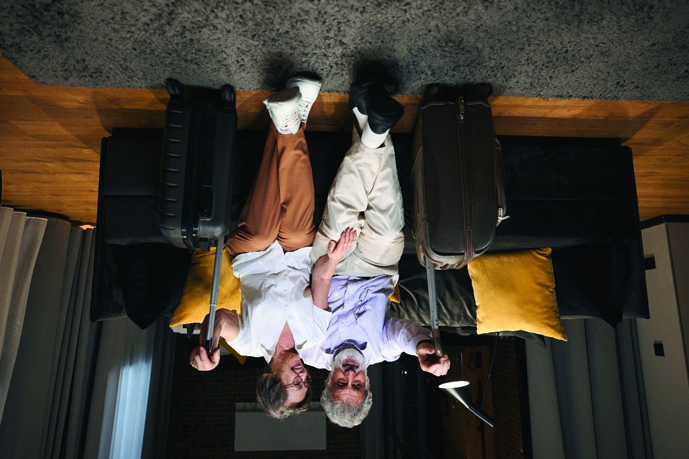 Senior travelers arriving at a hotel suite