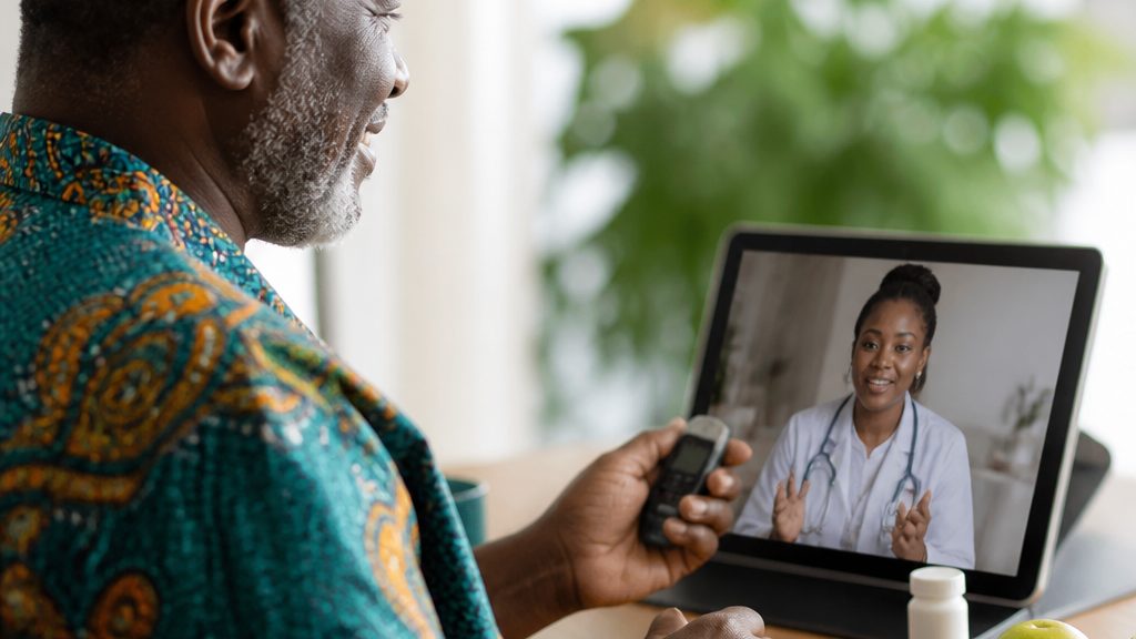 Person using a glucometer to check blood sugar at home