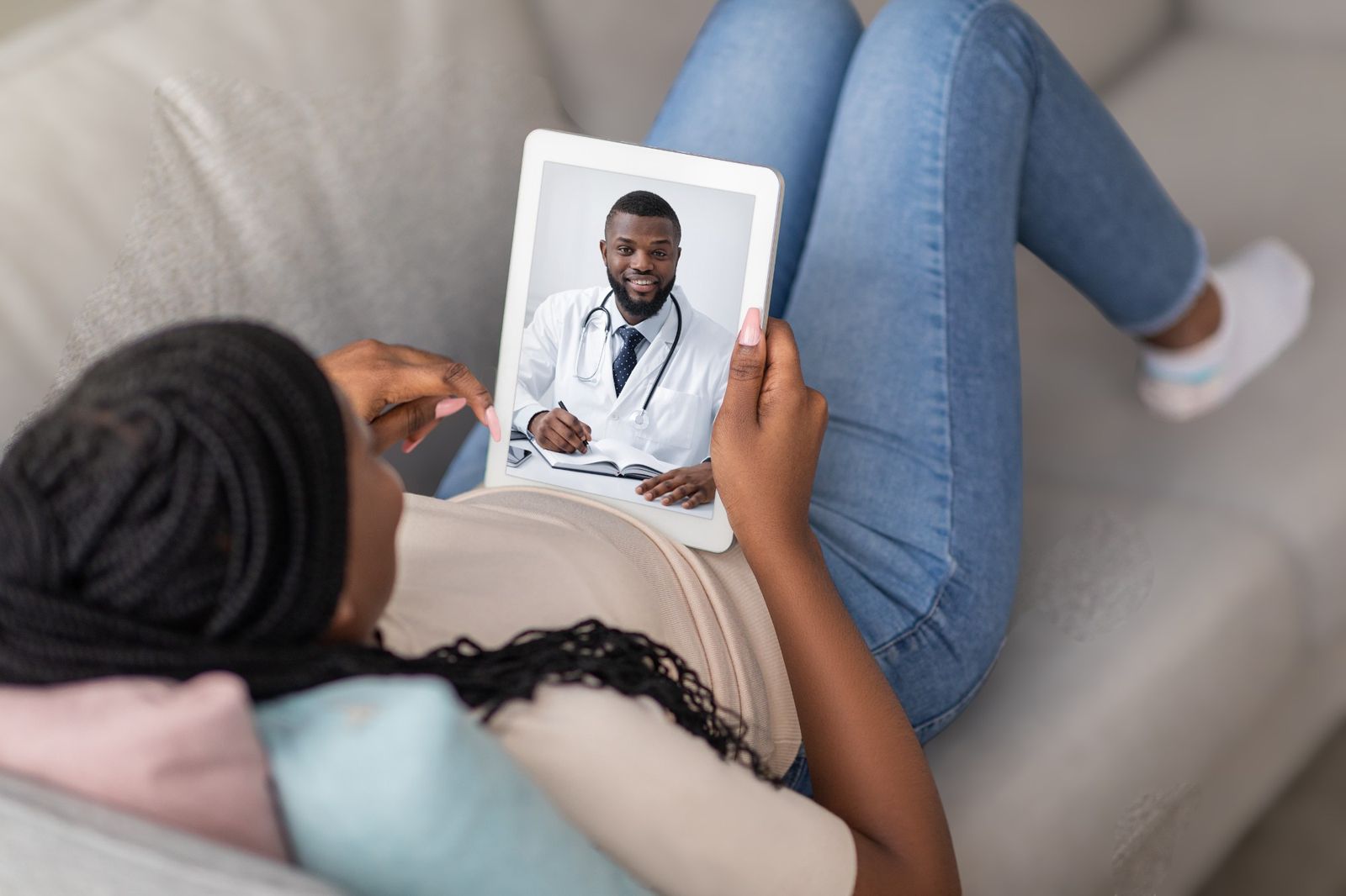 Patient consulting an AllRound specialist from home on a tablet